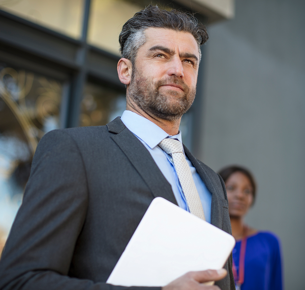 businessman-in-suit-waiting-outside-office-building-2024-09-15-23-25-24-UTC 1